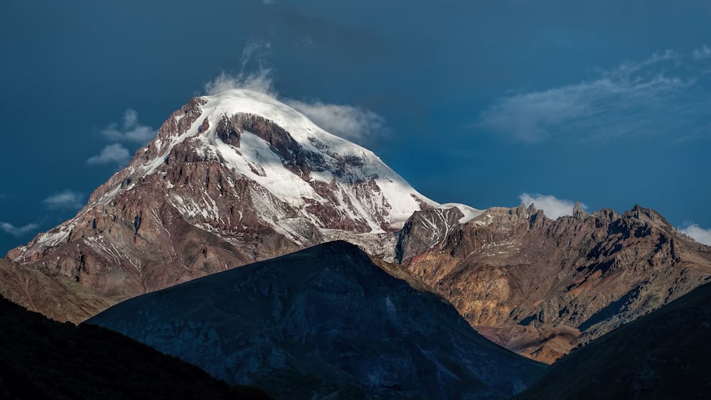 Kazbek mountain in the light of the rising sun