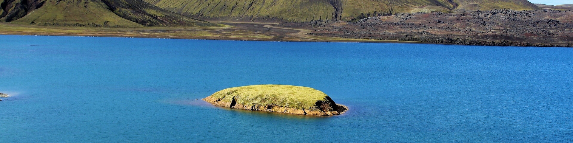 Frostastaðavatn is a lake in the Highlands of Iceland, not far from the famous mountains of Landmannalaugar and the volcano Hekla. Frostastaðavatn is Icelandic for "lake of the frosty place". No frost there in early September, but I can only imagine what it looks like in Winter! Anyone going to Landmannalaugar should definitely make a stop here. The views here and near this location are stunning and otherworldly!