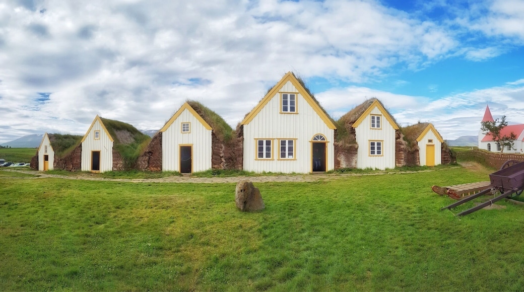 A beautiful collection of peat roofed buildings next to an attractive church in Glaumbær, Iceland