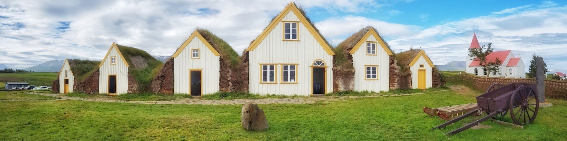 A beautiful collection of peat roofed buildings next to an attractive church in Glaumbær, Iceland