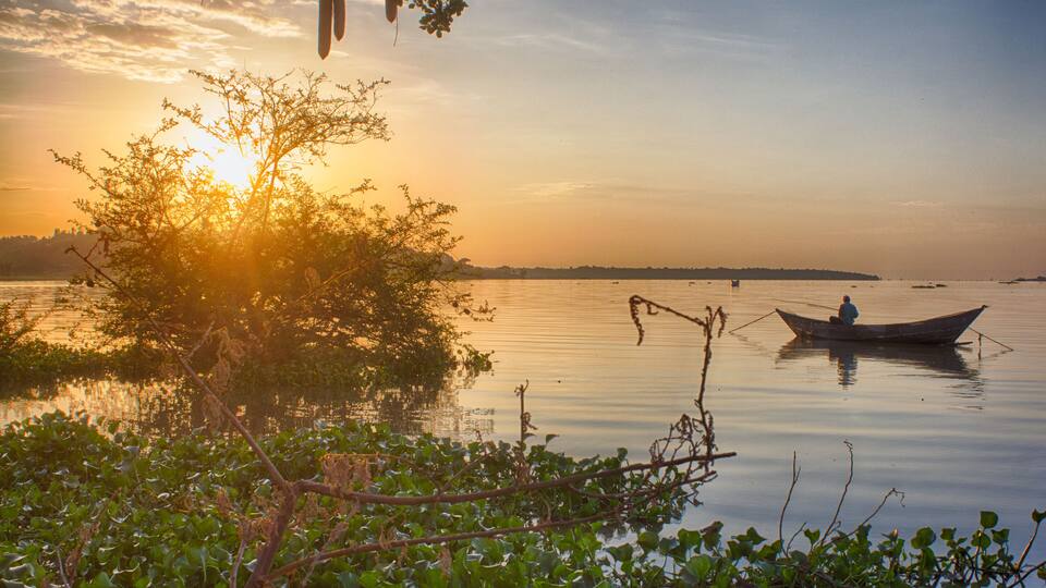 Sun rises on Lake Victoria near the village of Seme in western Kenya.