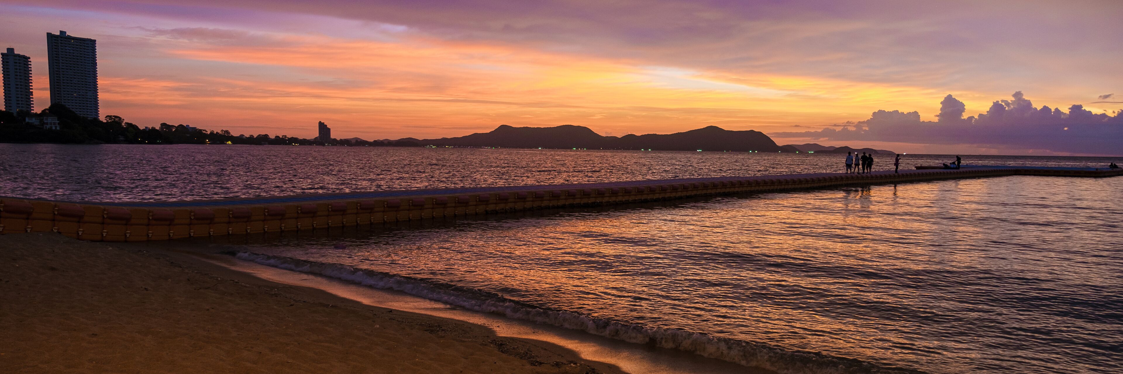 Beach in Pattaya during sunset in Thailand Ban Amphur beach. a tropical beach with palm trees during sunset