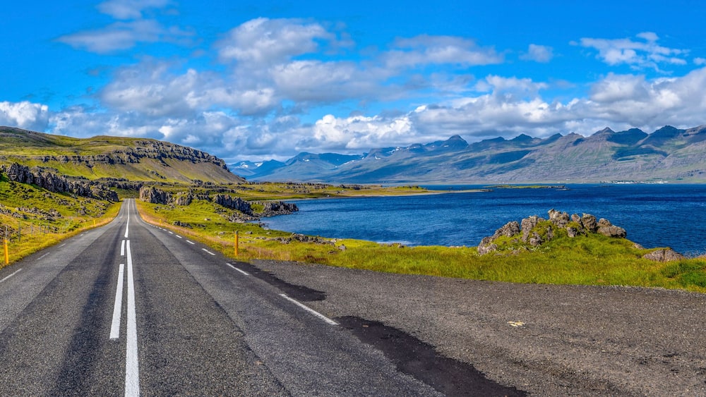 Ring road 1 in Eastern Iceland with the panoramic view at Stodvar Fjord at right.