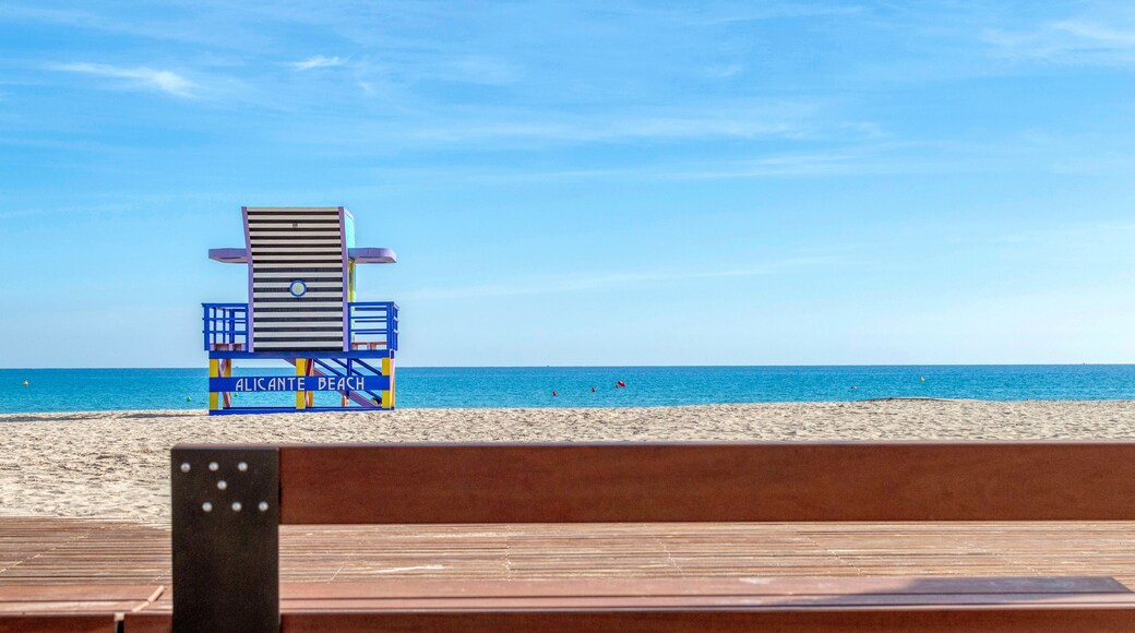 A lifeguard tower at Alicante Beach with a clear blue sky and calm sea.