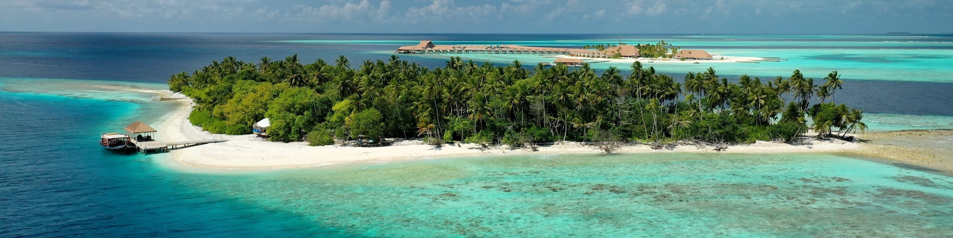 Bird's eye view of tropical islands in the ocean. View of the islands from a drone. Maldives, Thinadhoo (Vaavu Atoll), Dhigurah
