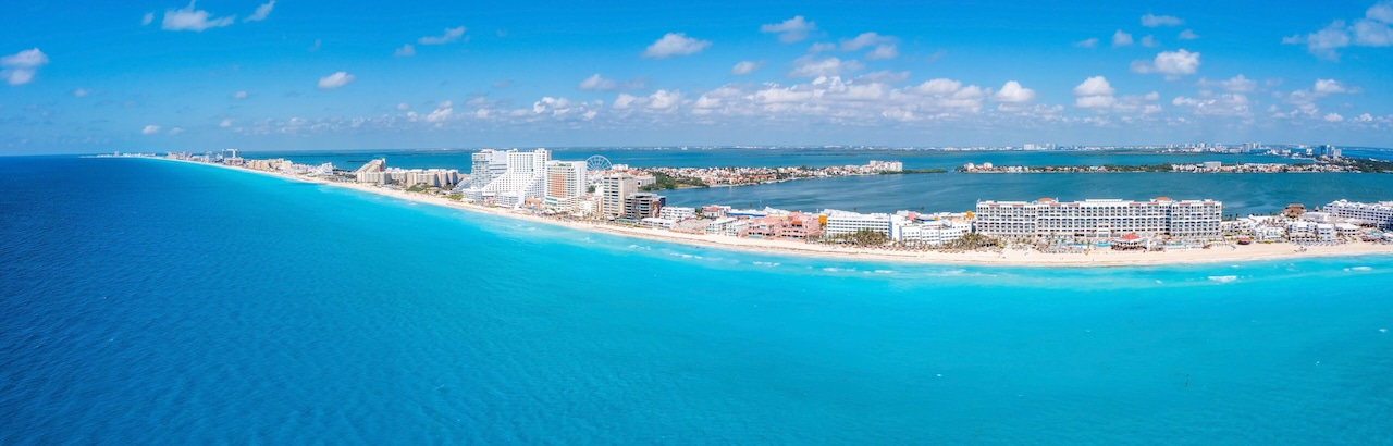 Aerial panoramic view of Punta Norte beach, Cancun, Mexico. Beautiful beach area with luxury hotels near the Caribbean sea in Cancun, Mexico.