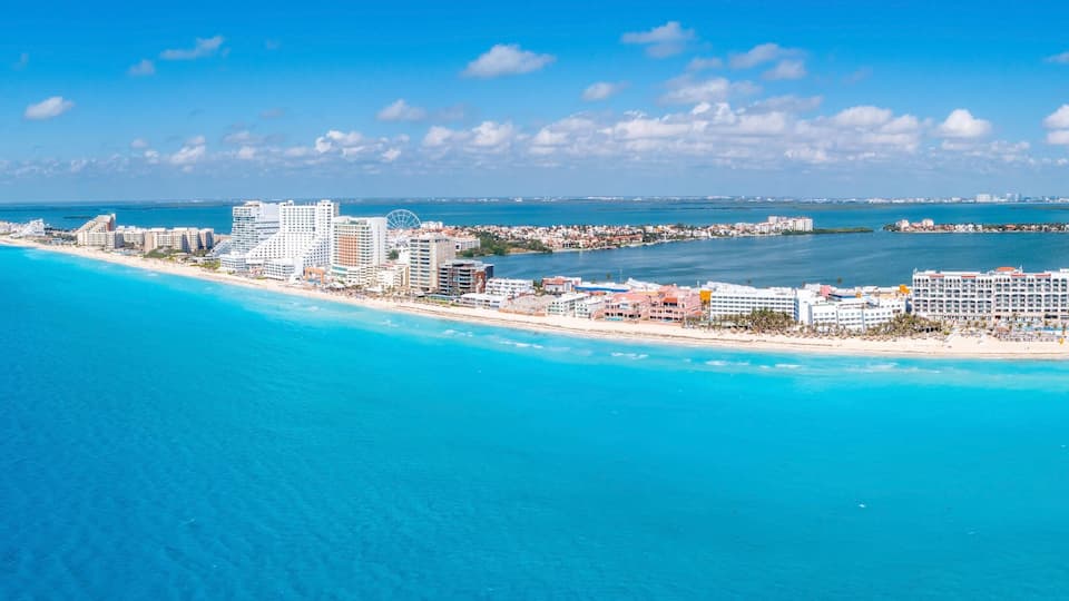 Aerial panoramic view of Punta Norte beach, Cancun, Mexico. Beautiful beach area with luxury hotels near the Caribbean sea in Cancun, Mexico.