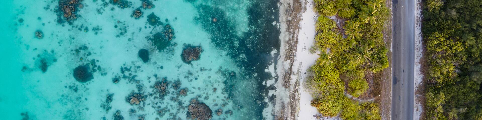 Aerial view of tropical beach landscape and local road at addu city, the southernmost atoll of Maldives in Indian ocean. Maldives tourism and summer vacation concepts