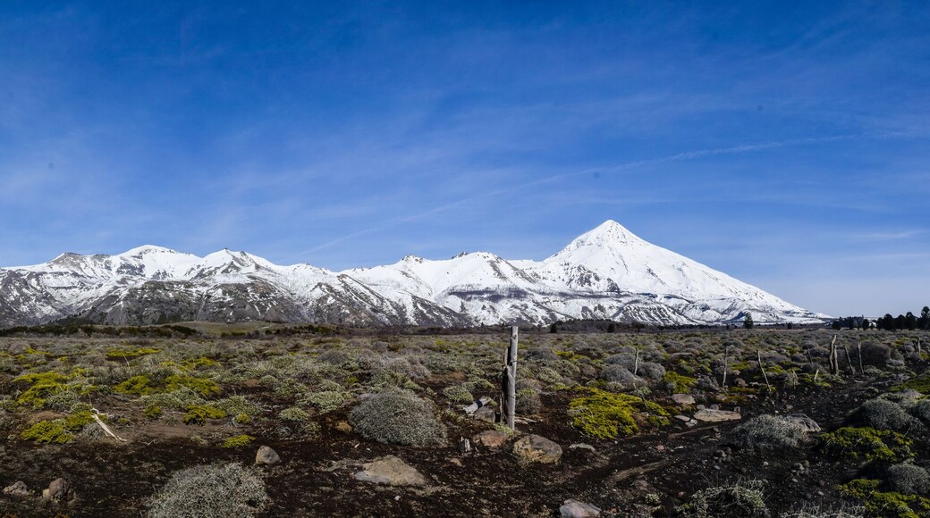 Panoramic view of the snow-capped Lanín Volcano in the Patagonian steppe of Argentina.