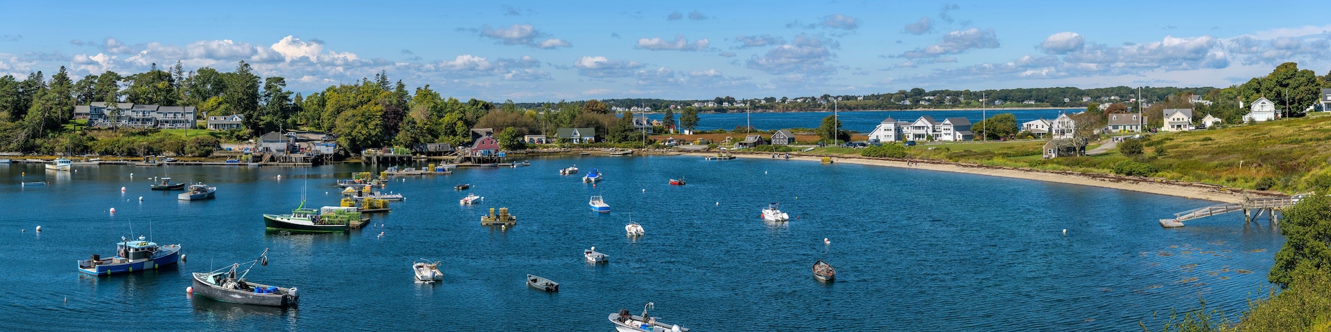 Mackerel Cove - A panoramic overview of lobster boats resting in Mackerel Cove at tip of Bailey Island on a sunny Autumn morning. Bailey Island, Harpswell, Maine, USA.