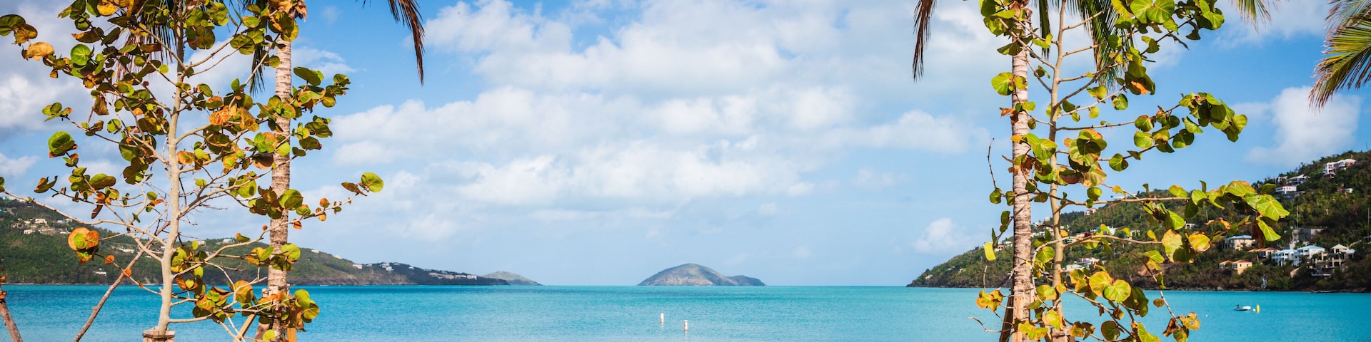 Nestled on the north coast of St. Thomas in the U.S. Virgin Islands, Magens Bay beach captivates with its powdery white sands, crystal-clear turquoise waters, and lush tropical foliage.