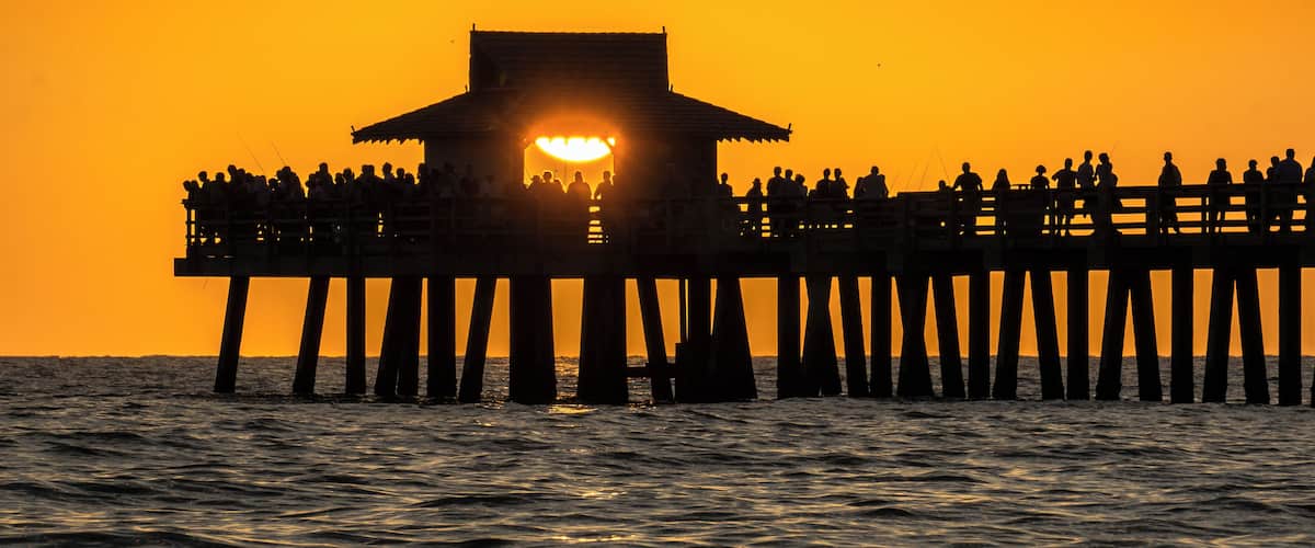 Inevitably, people flock to Naples Pier to watch and photograph the fabulous FL Gulf Coast sunsets. However the best shots are to be had from the beach with the pier as foreground interest. #Golden