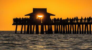 Inevitably, people flock to Naples Pier to watch and photograph the fabulous FL Gulf Coast sunsets. However the best shots are to be had from the beach with the pier as foreground interest. #Golden