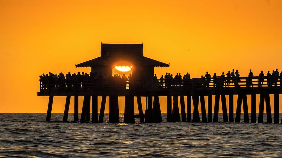 Inevitably, people flock to Naples Pier to watch and photograph the fabulous FL Gulf Coast sunsets. However the best shots are to be had from the beach with the pier as foreground interest. #Golden