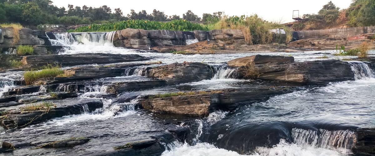 View of a magnificent ‘Bhatinda’ waterfall in the middle of the green forest surrounded by low hills which located in the Dhanbad district in the Indian state of Jharkhand