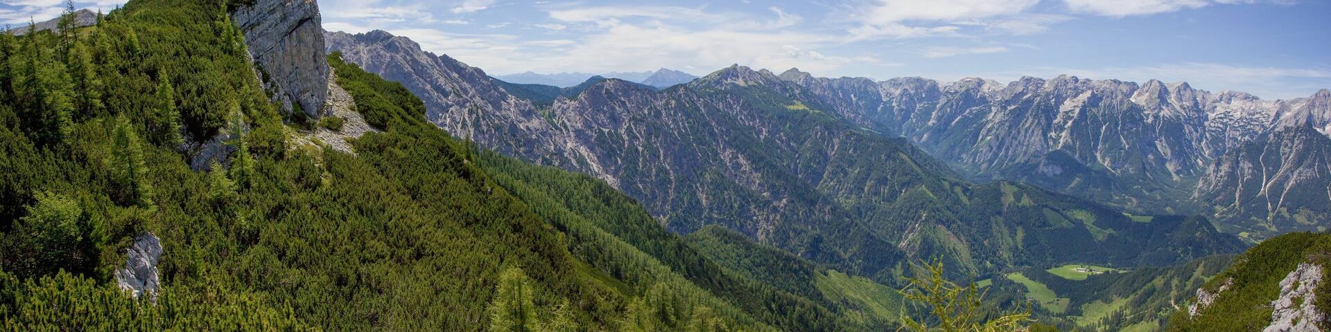 Panoramic view from Dachsteinblick point to the highest mountains of Totes Gebirge mountains and Steyr river valley, Alps, Austria