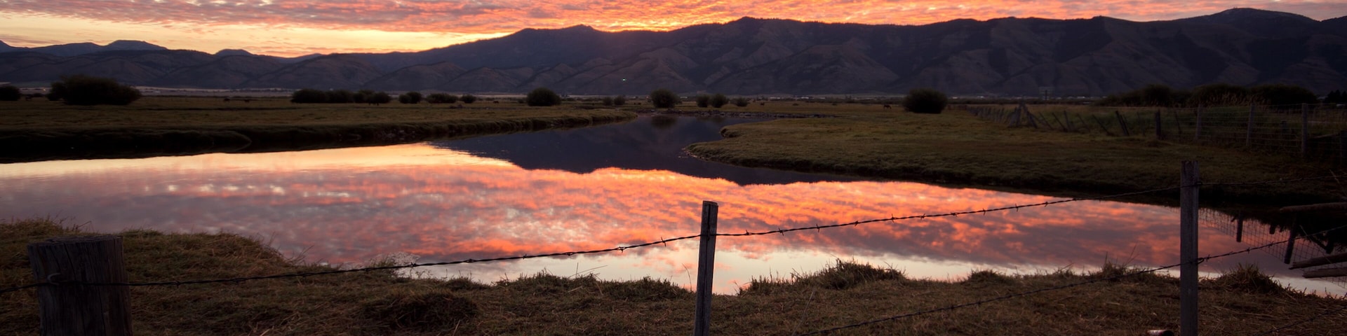 Sunrise reflecting in the Salt River in the Wyoming landscape in Star Valley.