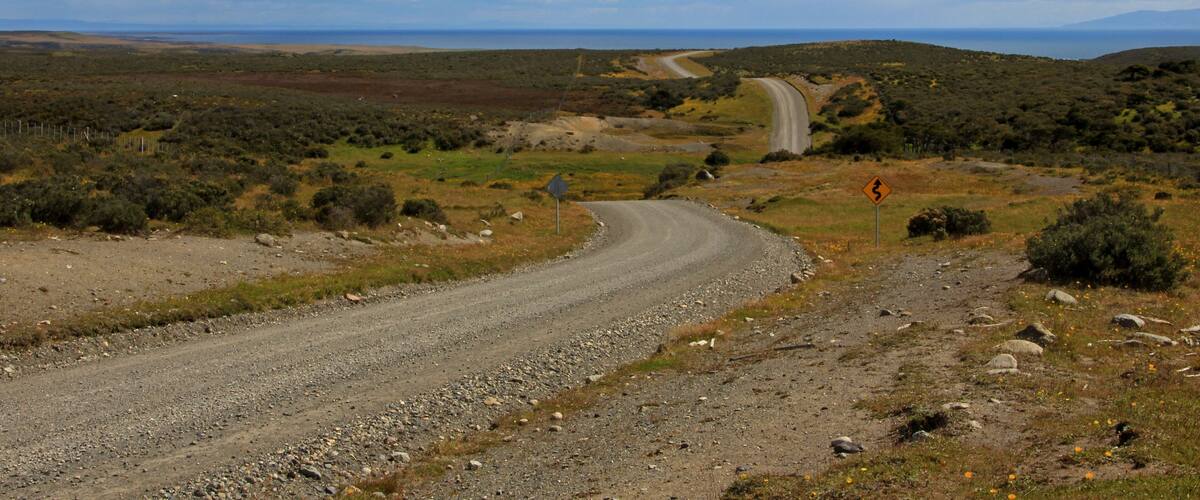 Gravel road trough landscape in Tierra del Fuego, Patagonia, Chile