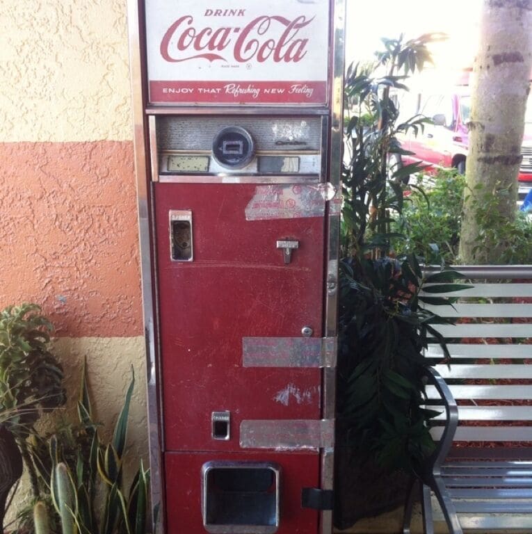 Antique coca cola soda machine outside of Mel's diner. For display purpose I assume, doesn't operate.  