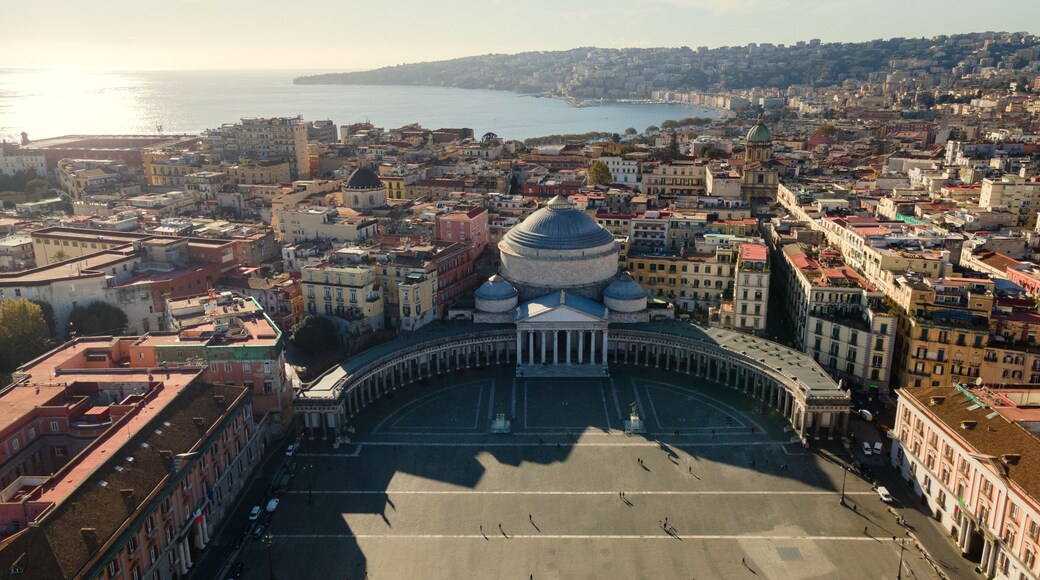 Panoramic drone view of the entire city of Naples in southern Italy. Flight over historical landmarks in Naples, Italy. Plebischito central square and royal palace