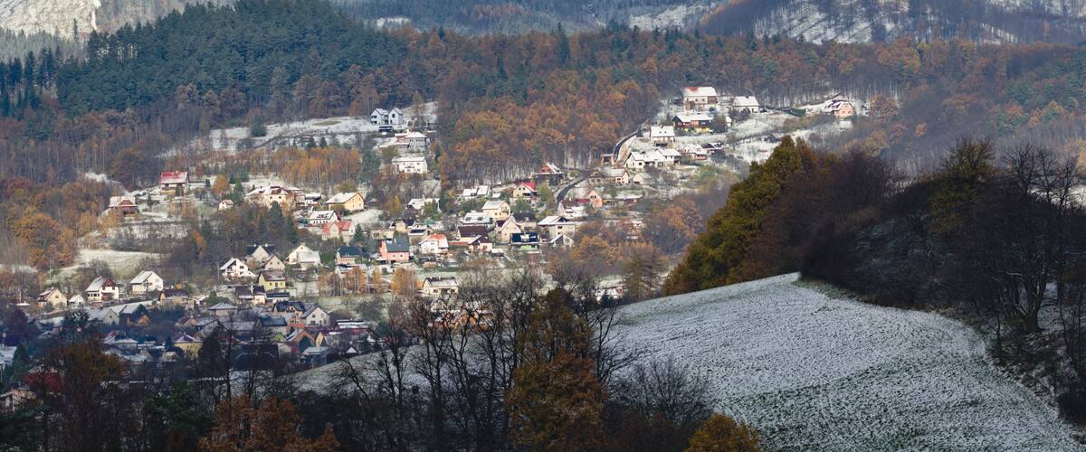 Residential area in city Zubri near to Roznov pod Radhostem. Very small Czech city on the foothills covered by first snow in late autumn. Winter is coming. Czech republic countryside.