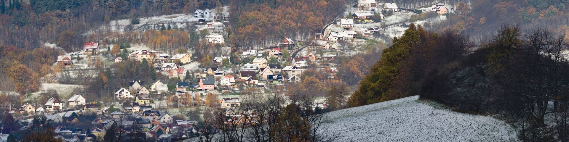Residential area in city Zubri near to Roznov pod Radhostem. Very small Czech city on the foothills covered by first snow in late autumn. Winter is coming. Czech republic countryside.