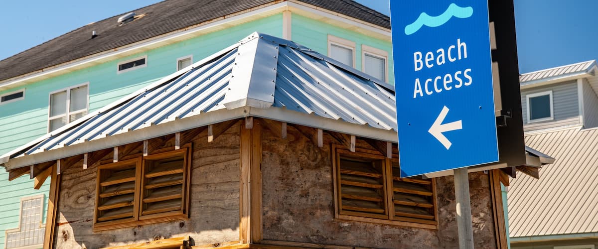 West Beach which includes signage and a house
