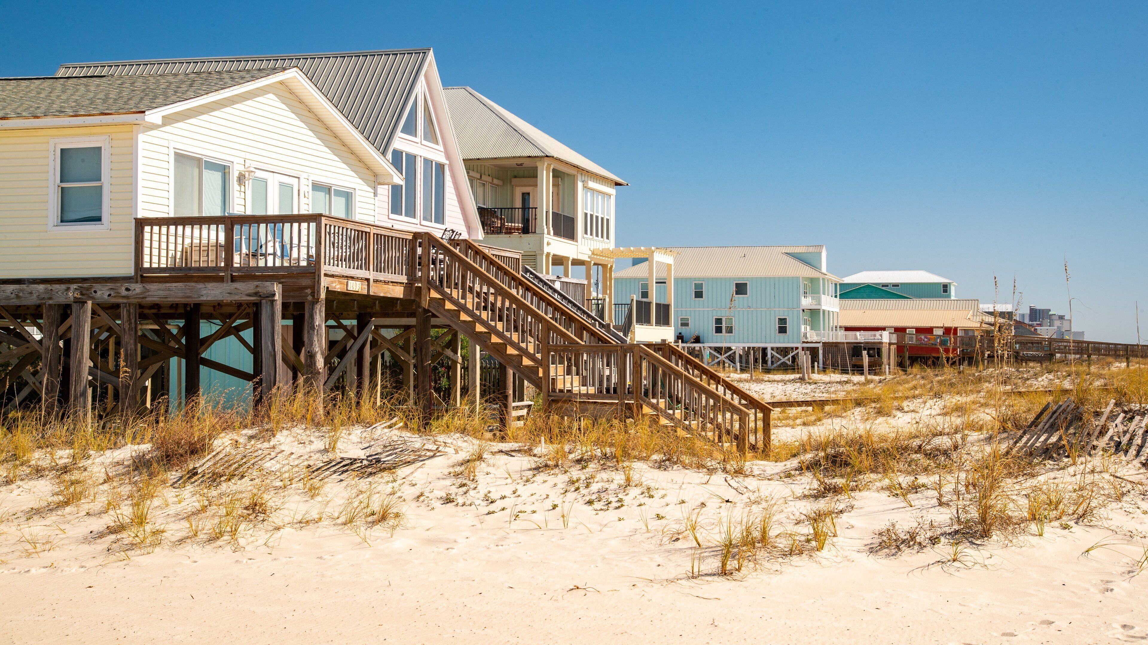 West Beach featuring a beach, a house and a coastal town
