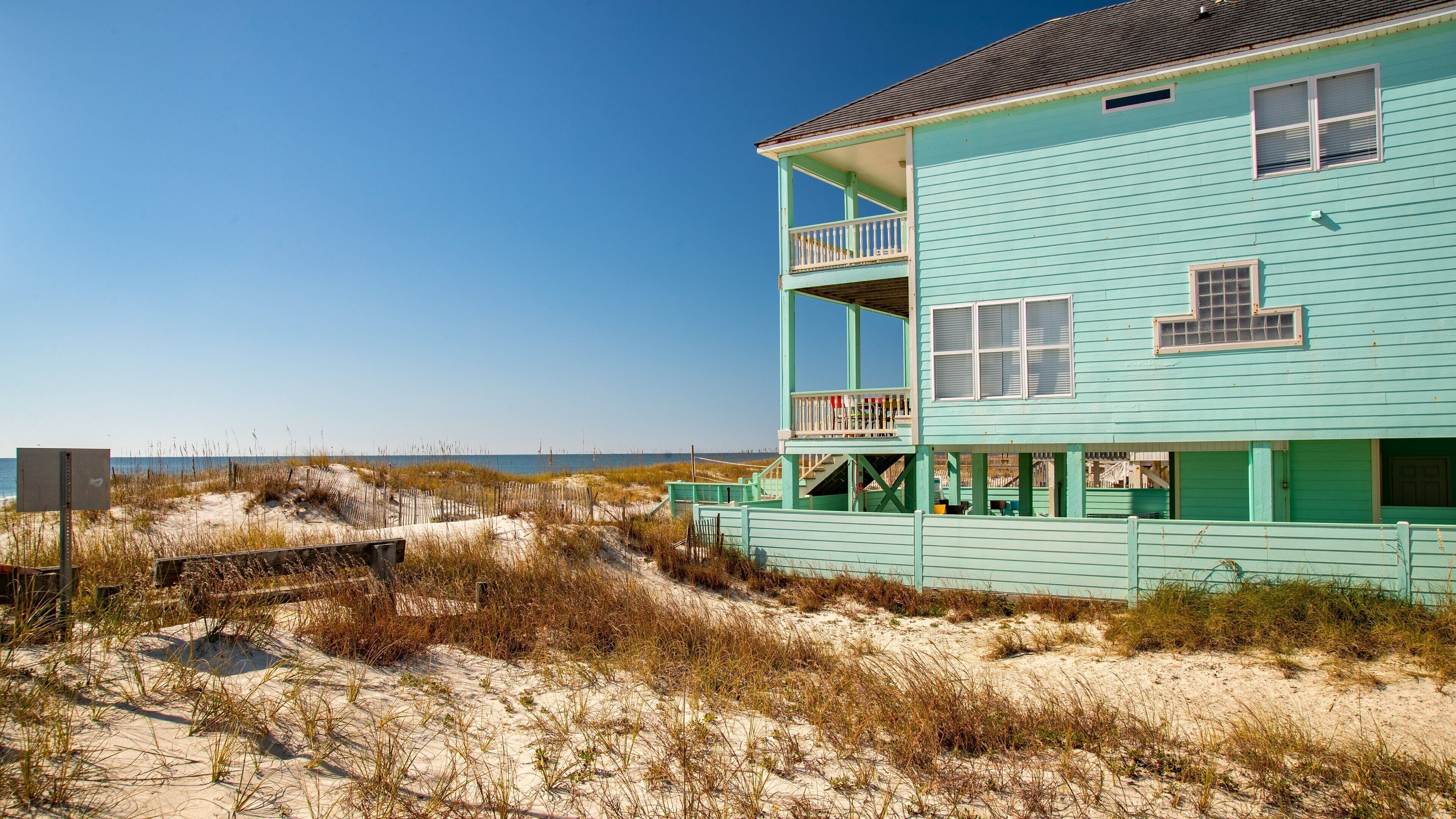West Beach which includes general coastal views, a sandy beach and a house