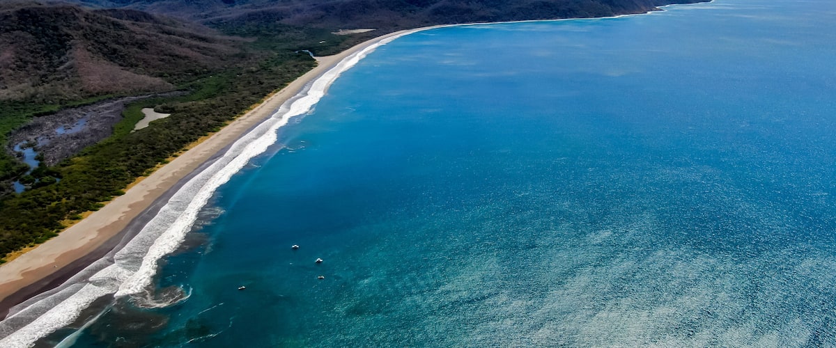 Beautiful aerial view of a sunset in Naranjo Beach - Witch Rock Costa Rica