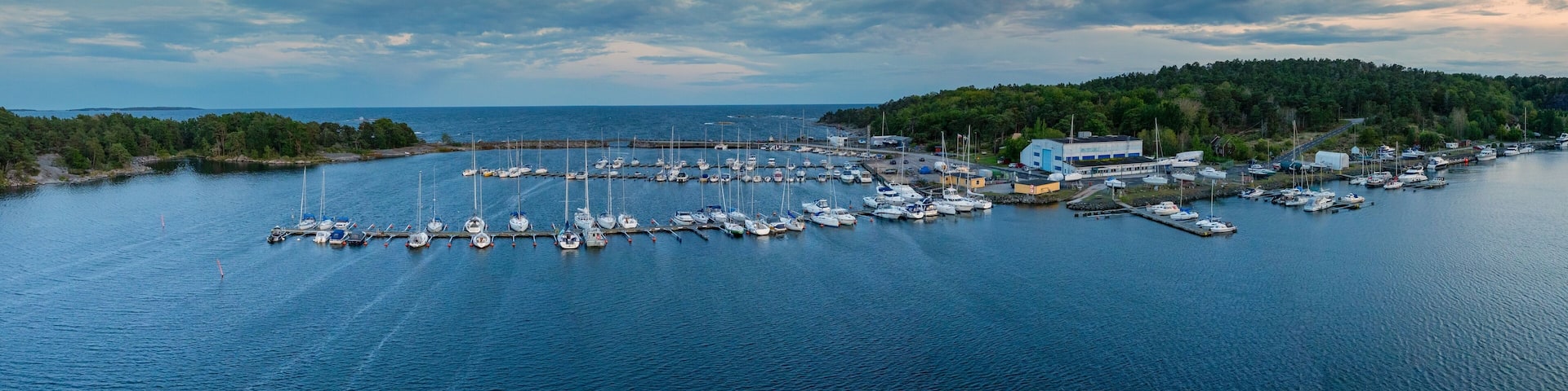 panorama drone view of the yacht harbor and marina of Karlshamn in southern Sweden at sunset