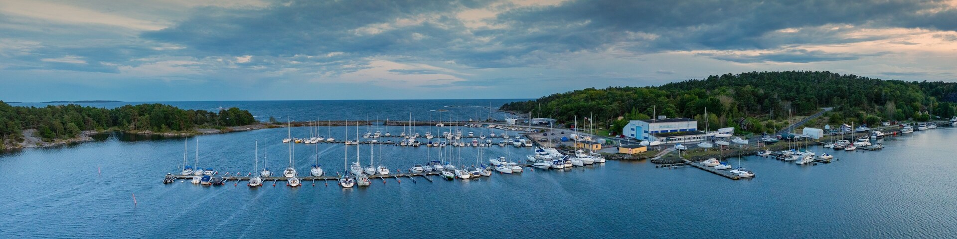 panorama drone view of the yacht harbor and marina of Karlshamn in southern Sweden at sunset