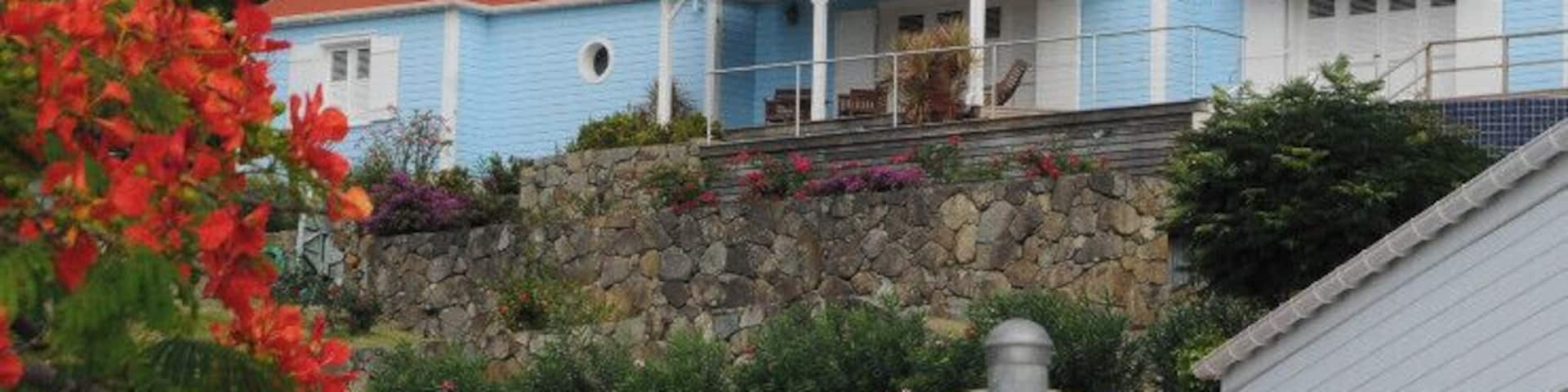 St Barts is a small territory of France located in the Leeward Islands at the northeastern corner of the Caribbean Sea.
The Gustavia Lighthouse is located on a hill at the historic Fort Gustave overlooking Gustavia harbor on the west side of the island. The island has an identity crisis and can be called St.-Barthélemy, St. Barths, or St. Barts depending on who you are talking to and how fancy they are.
It caters to a well-heeled clientele and the marina is jam packed with fabulous Yachts.