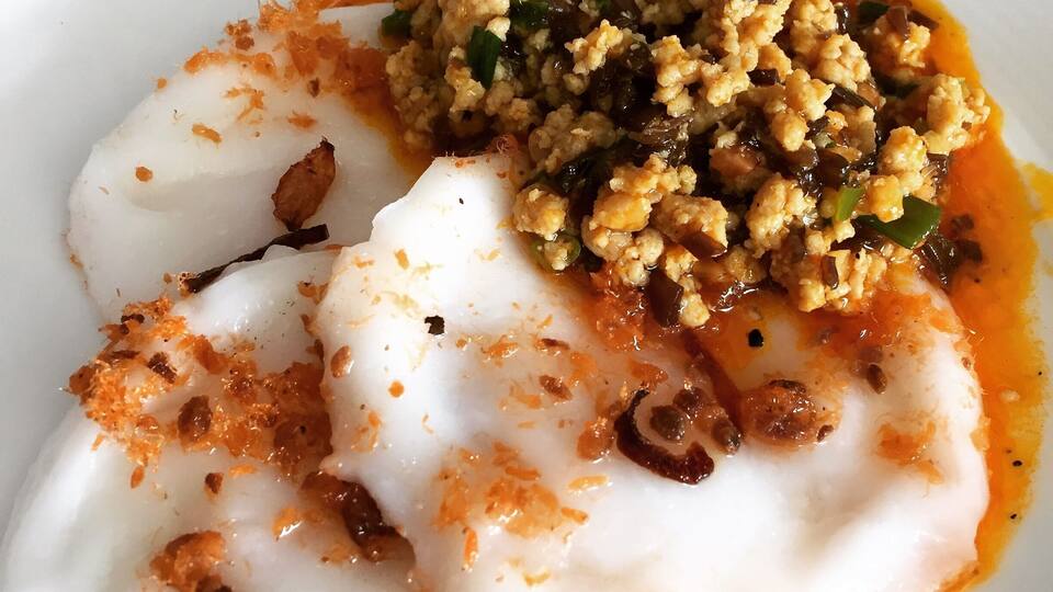 Must try their Bánh bèo or steamed rice cakes which they serve at breakfast. It is white in color and typically served with savory ingredients such as chopped dried or fresh shrimp, scallions, mung bean paste, crispy fried shallots, fish sauce, rice vinegar, and oil.