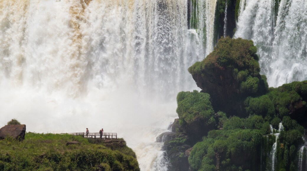 Tourists near huge waterfall at Iguazu National Park, Argentina