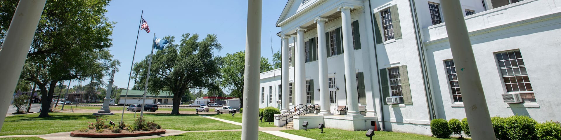 Tallulah, Louisiana, USA - April 23, 2024: Afternoon sun shines on the historic 1887 Madison Parish Courthouse of downtown Tallulah.