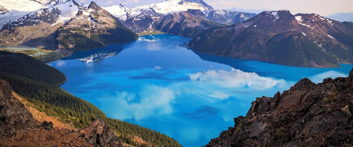 One of the most beautiful views I’ve ever seen! Take me back! This is Garibaldi Lake below Mount Garibaldi in Garibaldi Provincial Park, BC. The lake is glacier fed. Because of the silt, the surface is opaque, providing pristine reflection, of the clouds even! #canada #bcparks #britishcolumbia #garibaldilake