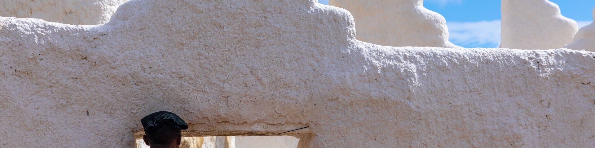 Oromo pilgrim looking inside the shrine of sufi Sheikh Hussein , Oromia, Sheik Hussein, Ethiopia