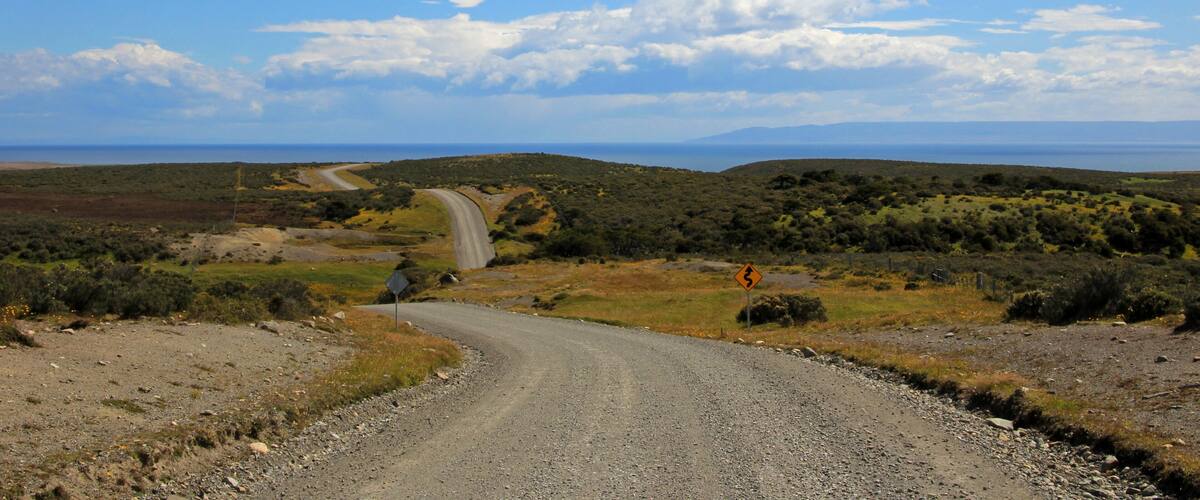 Gravel road trough landscape in Tierra del Fuego, Patagonia, Chile