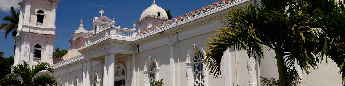 White Catholic church of Naranjo parish in Costa Rica on a sunny blue sky day