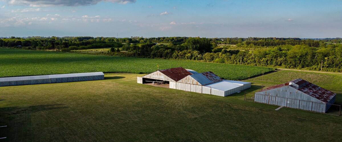 aircraft hangars on a grass runway