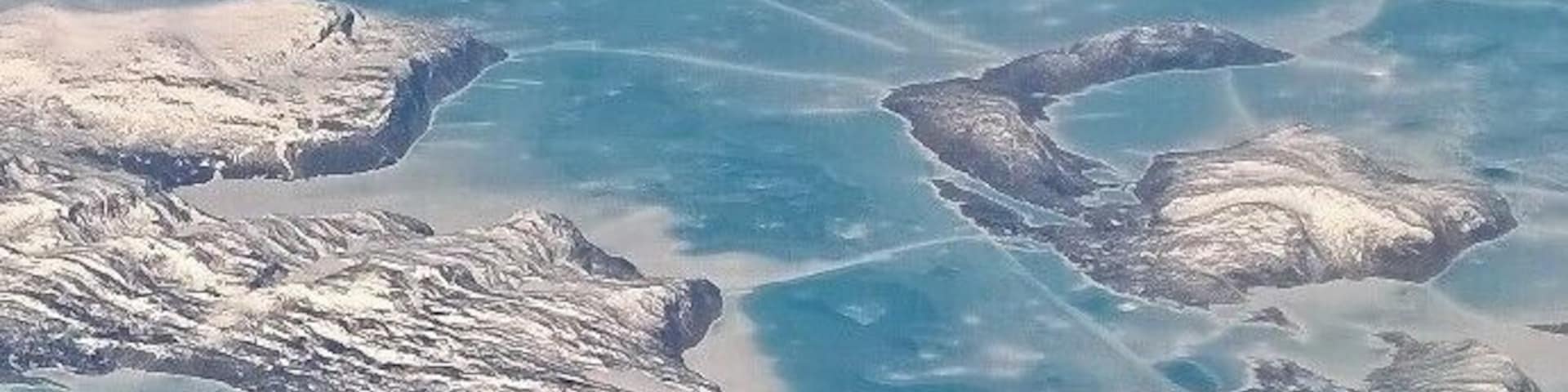 View of the east coast of Baffin Island from 35K feet. Pic was taken in June 2014. Notice the extensive ice.