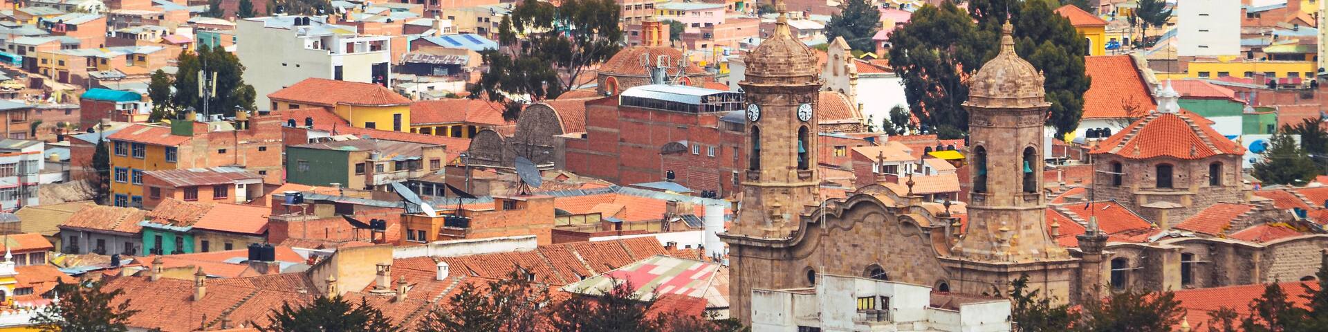 Distant view of the roofs and houses in Potosi city an the Cathedral Basilica of Our Lady of Peace. Bolivia, Southamerica.