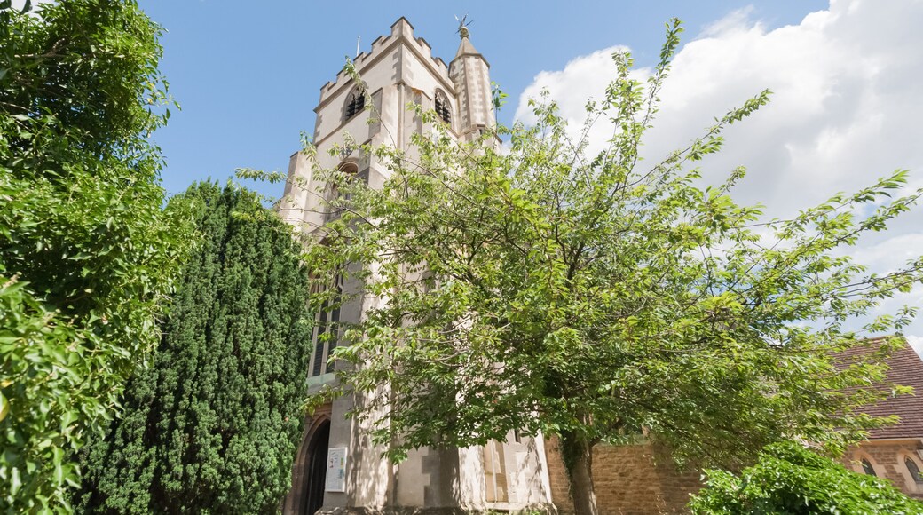 lush vegetation surrounding All Saints church in Wokingham, UK