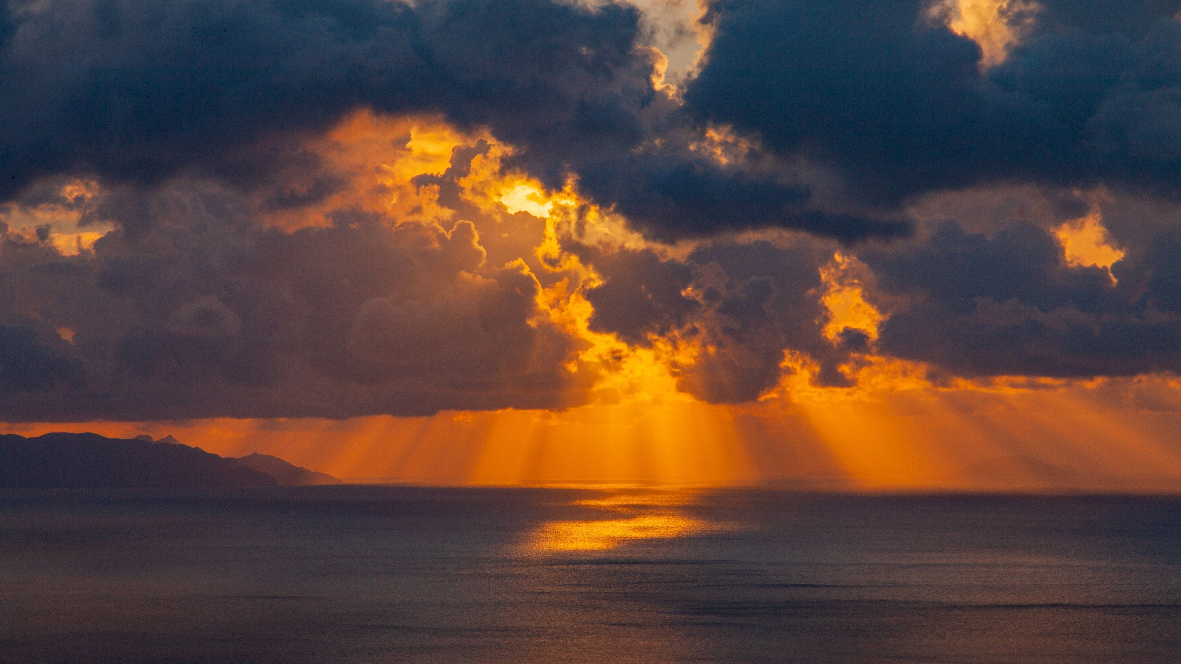 Santorini showing general coastal views and a sunset