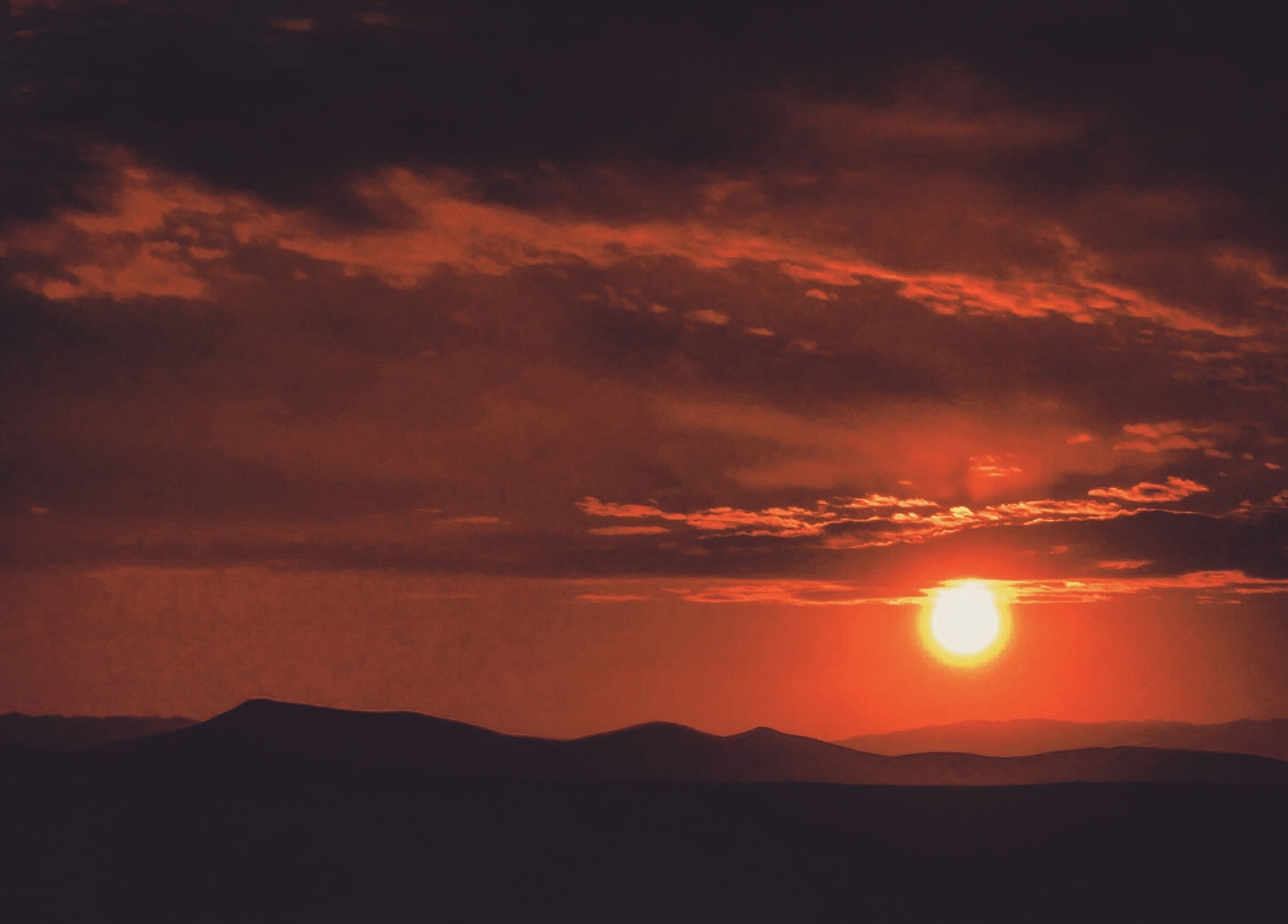 Fiery sunset atop the dunes.