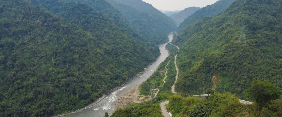 the kameng river in a deep valley surrounded by mountains of the himalayas near pinjoli stream arunachal pradesh, India.