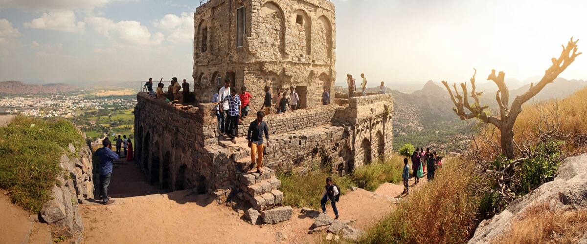 Gingee Fort or Senji Fort, Tamil Nadu, India, December 4, 2018: View of the valley with a fortress on top of the mountain