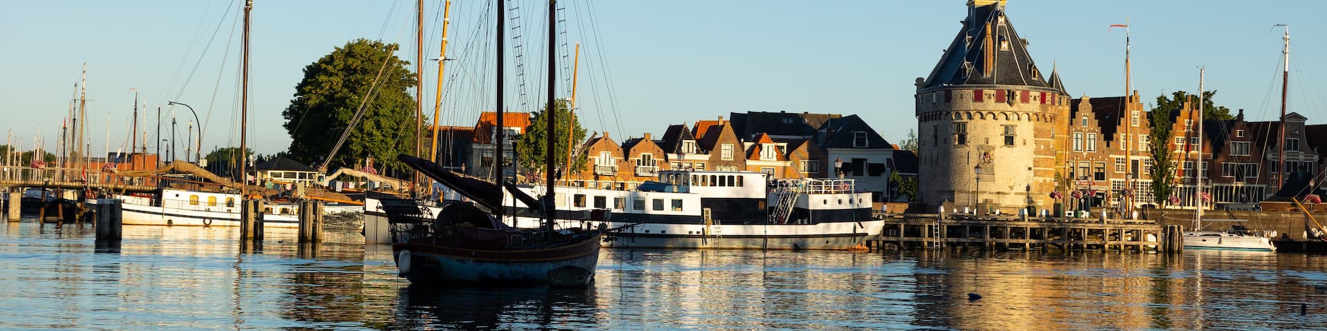 Scenic view of ancient Hoofdtoren tower standing at harbor of Dutch city of Hoorn