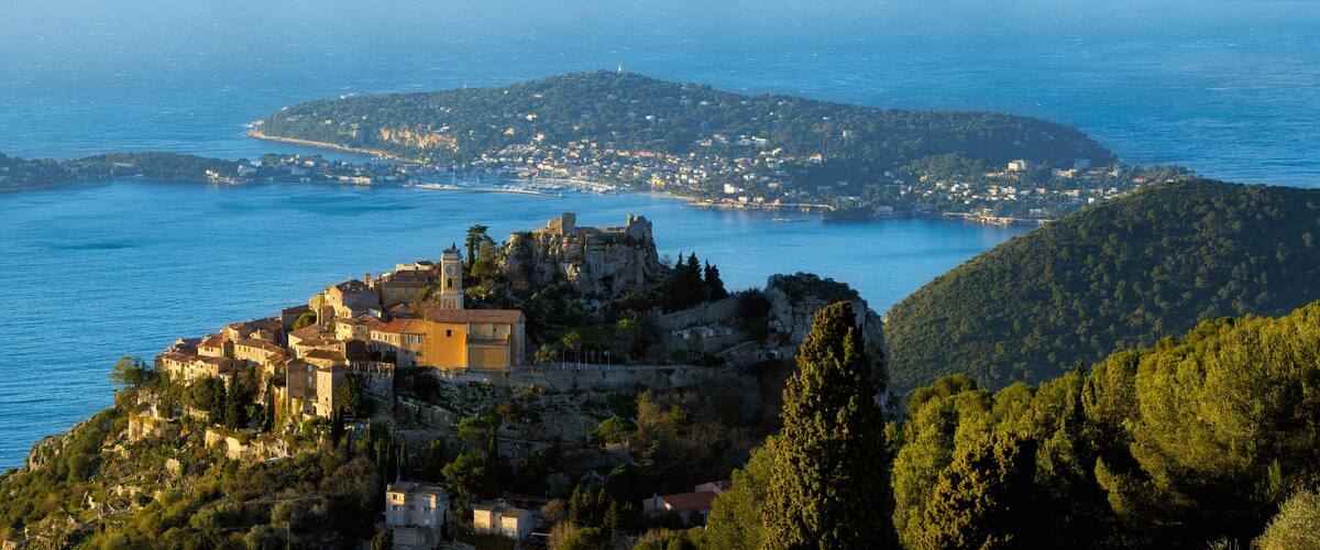 The Village of Eze (Èze), the Mediterranean Sea and Saint-Jean-Cap-Ferrat at sunrise. Alpes-Maritimes, French Riviera, Cote d'Azur, France